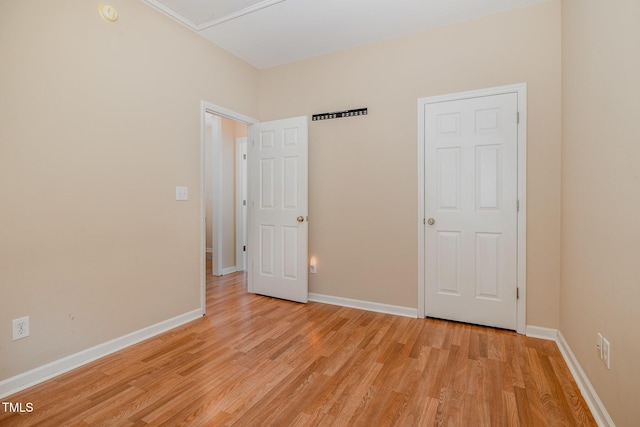 209 Mccarthy Dr, Clayton, NC 27527 - unfurnished bedroom featuring light wood finished floors and baseboards