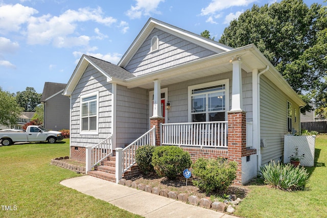 209 Mccarthy Dr, Clayton, NC 27527 - bungalow-style house featuring covered porch and a front lawn