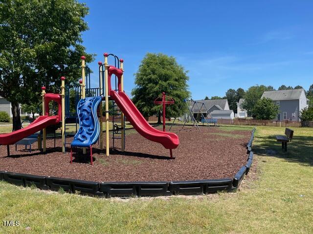 209 Mccarthy Dr, Clayton, NC 27527 - community jungle gym featuring a yard