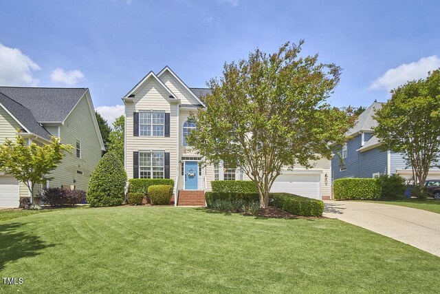 traditional-style home featuring a front lawn and driveway