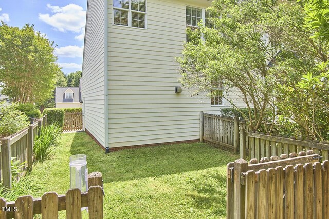 view of yard with a fenced backyard