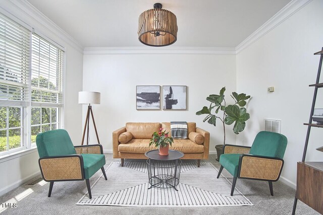 carpeted living room featuring baseboards, ornamental molding, and visible vents