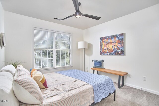 bedroom with baseboards, ceiling fan, carpet, and visible vents