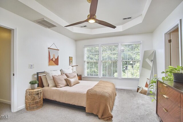 bedroom featuring baseboards, visible vents, and carpet