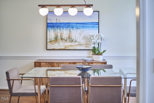 dining area with wood finished floors