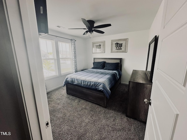 carpeted bedroom featuring a ceiling fan, baseboards, and visible vents