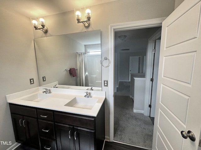 bathroom featuring double vanity, a sink, visible vents, and a shower with curtain