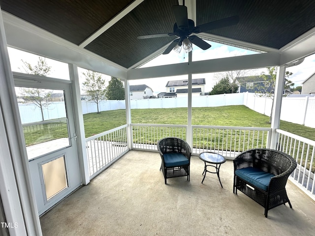sunroom featuring ceiling fan