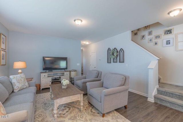 79 Hawkstone Dr, Clayton, NC 27527 - living area with stairs, baseboards, and wood finished floors