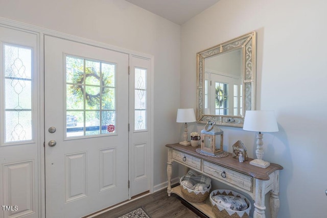 79 Hawkstone Dr, Clayton, NC 27527 - foyer entrance featuring dark wood finished floors and a healthy amount of sunlight