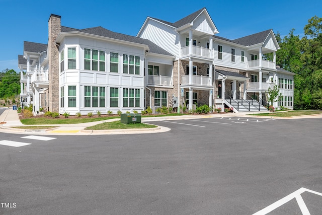 view of property featuring uncovered parking