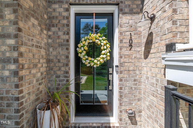 entrance to property with brick siding