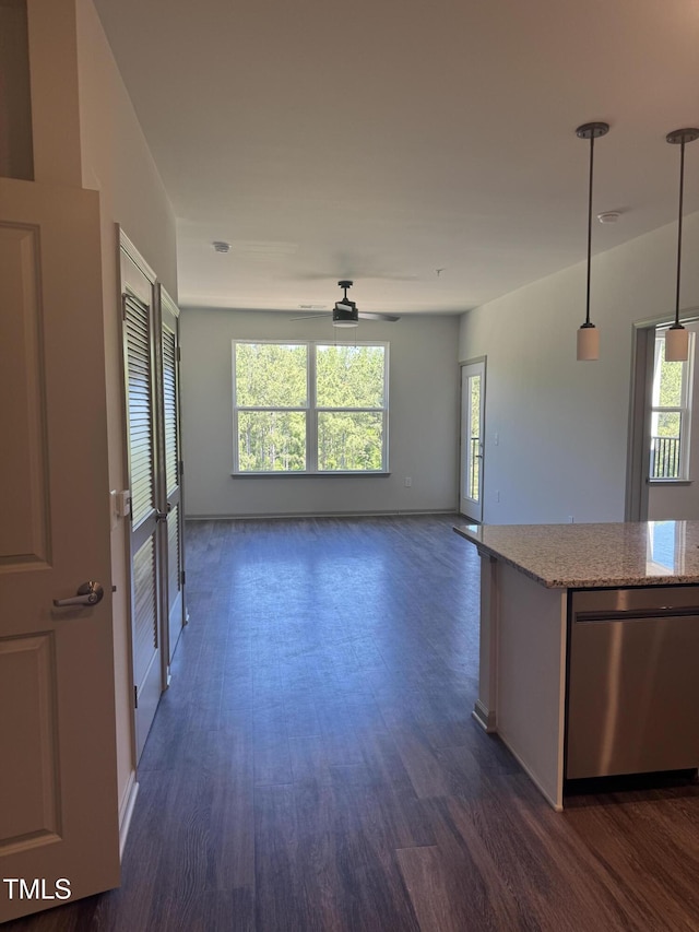 2418 Gathering Square Ct, Fuquay Varina, NC 27526 - unfurnished living room with a ceiling fan, a wealth of natural light, and dark wood-style flooring