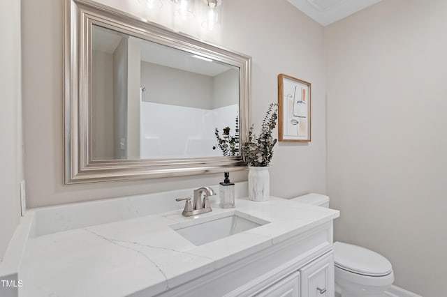 bathroom featuring vanity and toilet
