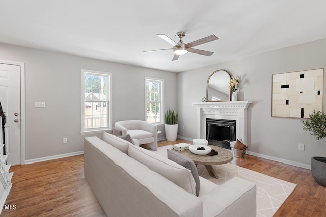 5612 Sandy Trail Dr, Knightdale, NC 27545 - living area with a fireplace, baseboards, a ceiling fan, and light wood-style floors