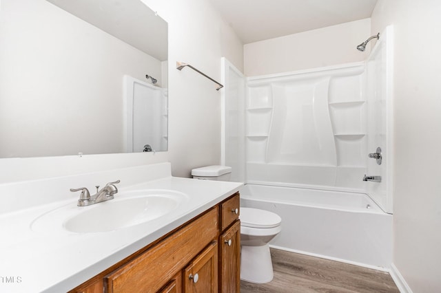 full bath with wood finished floors, toilet, vanity, and bathing tub / shower combination