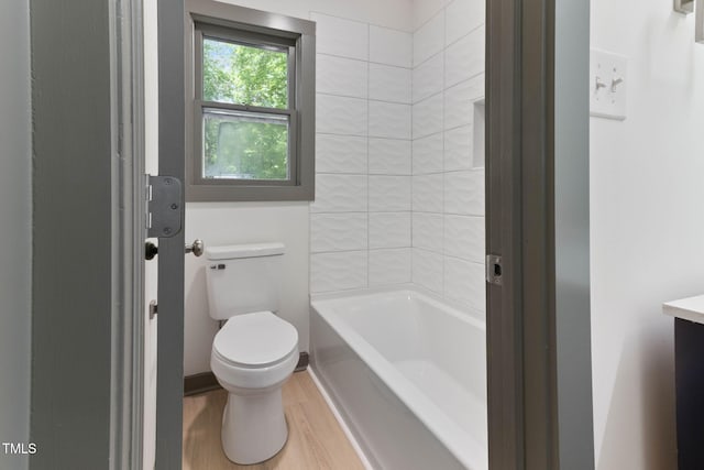full bathroom featuring wood finished floors, toilet, and vanity