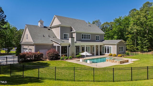 6 Castlewood Dr, Durham, NC 27713 - rear view of property with a garage, a pool with connected hot tub, a patio area, and a shingled roof
