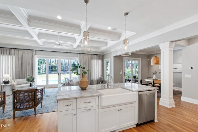 6 Castlewood Dr, Durham, NC 27713 - kitchen with stainless steel dishwasher, a sink, decorative columns, crown molding, and light wood-style floors