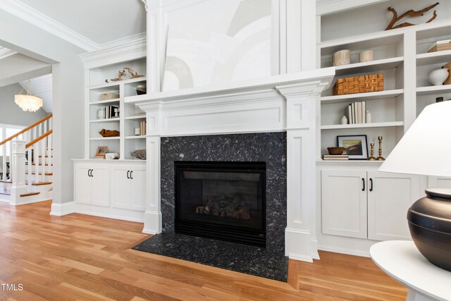 6 Castlewood Dr, Durham, NC 27713 - living area with light wood-style flooring, stairway, a fireplace, ornamental molding, and baseboards