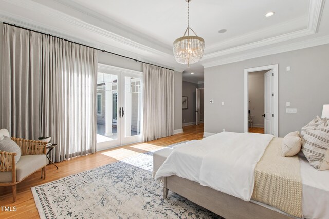 6 Castlewood Dr, Durham, NC 27713 - bedroom with access to outside, ornamental molding, wood finished floors, a chandelier, and french doors