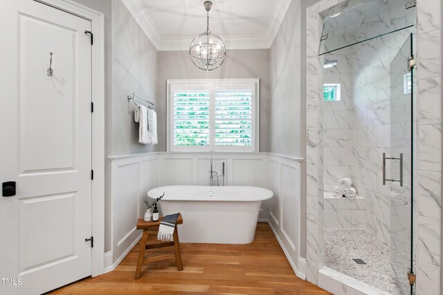 6 Castlewood Dr, Durham, NC 27713 - full bath featuring a marble finish shower, crown molding, a freestanding tub, a decorative wall, and wood finished floors