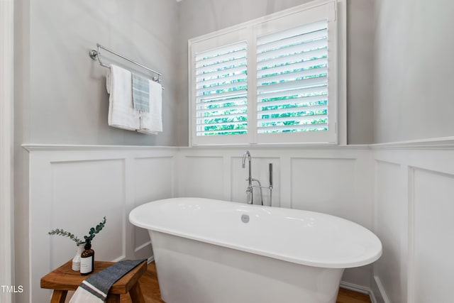 6 Castlewood Dr, Durham, NC 27713 - full bath featuring a decorative wall, wainscoting, and a soaking tub