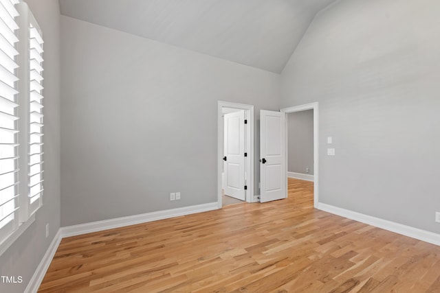 6 Castlewood Dr, Durham, NC 27713 - unfurnished room with high vaulted ceiling, light wood-type flooring, and baseboards