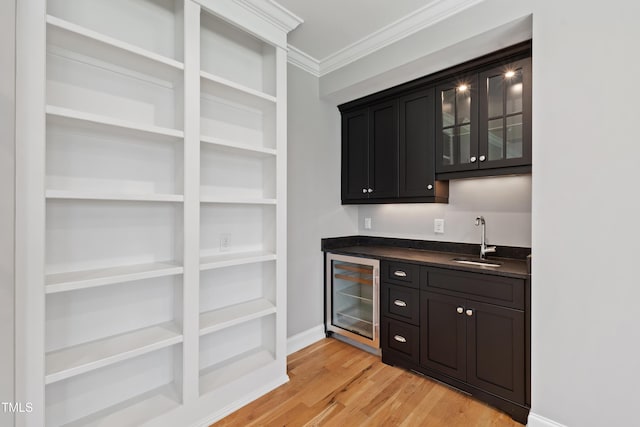 6 Castlewood Dr, Durham, NC 27713 - indoor wet bar with beverage cooler, light wood-style flooring, ornamental molding, and baseboards