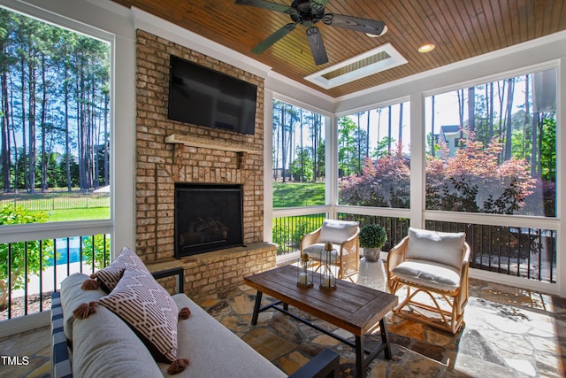 6 Castlewood Dr, Durham, NC 27713 - sunroom / solarium featuring plenty of natural light, a ceiling fan, and an outdoor living space with a fireplace