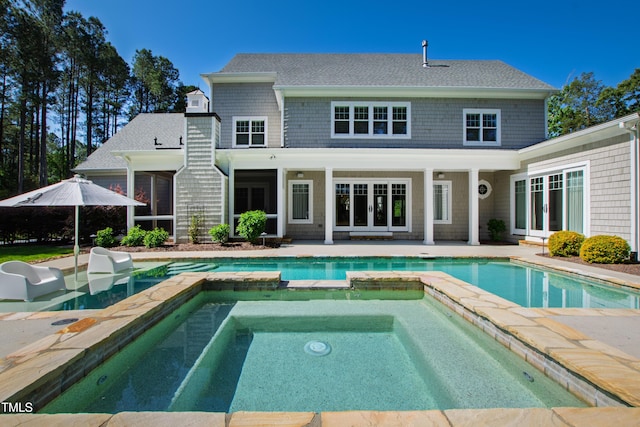 6 Castlewood Dr, Durham, NC 27713 - back of property featuring a patio, a pool with connected hot tub, french doors, and roof with shingles