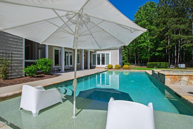 6 Castlewood Dr, Durham, NC 27713 - view of swimming pool with french doors, a patio area, fence, and a pool with connected hot tub