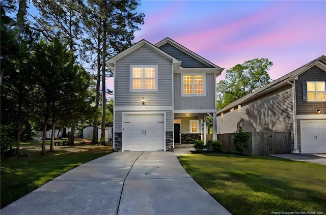 915 Carolina Ave, Fayetteville, NC 28301 - view of front of house featuring driveway, fence, a front lawn, and a garage