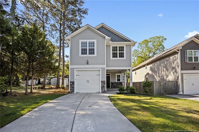 915 Carolina Ave, Fayetteville, NC 28301 - view of front of house with stone siding, driveway, a front yard, and a garage
