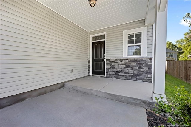 915 Carolina Ave, Fayetteville, NC 28301 - doorway to property featuring fence and stone siding