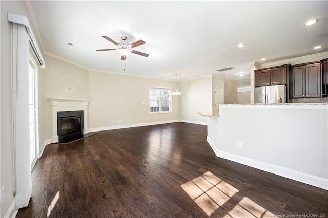 915 Carolina Ave, Fayetteville, NC 28301 - unfurnished living room featuring crown molding, a ceiling fan, a glass covered fireplace, and recessed lighting