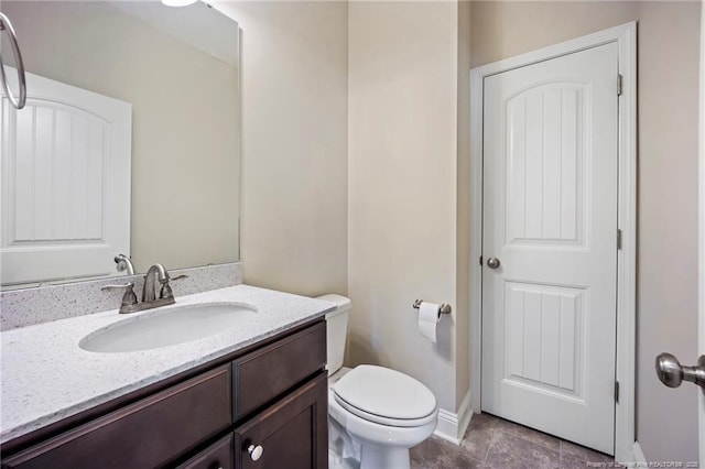 915 Carolina Ave, Fayetteville, NC 28301 - bathroom with vanity, baseboards, tile patterned flooring, and toilet