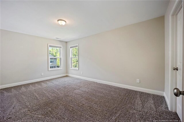 915 Carolina Ave, Fayetteville, NC 28301 - carpeted spare room with baseboards