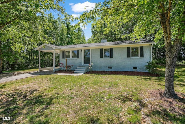 ranch-style house with brick siding, a front lawn, crawl space, and concrete driveway