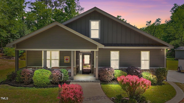 109 Rustler Rd, Louisburg, NC 27549 - craftsman-style house with a porch, board and batten siding, a standing seam roof, and a metal roof