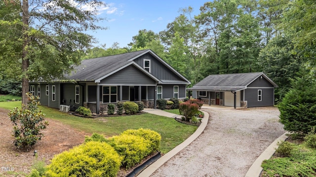 109 Rustler Rd, Louisburg, NC 27549 - ranch-style home with driveway, a front yard, and board and batten siding