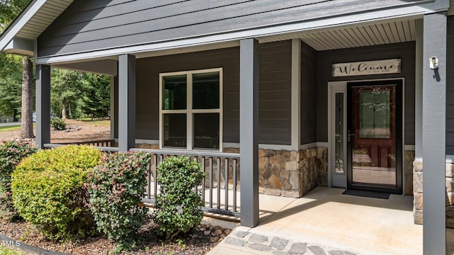 109 Rustler Rd, Louisburg, NC 27549 - entrance to property with covered porch and stone siding