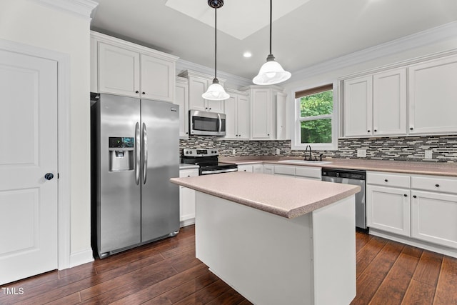 109 Rustler Rd, Louisburg, NC 27549 - kitchen with appliances with stainless steel finishes, white cabinetry, dark wood-style floors, crown molding, and recessed lighting