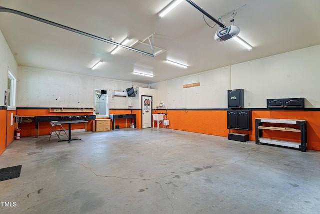 109 Rustler Rd, Louisburg, NC 27549 - garage with a workshop area and a garage door opener