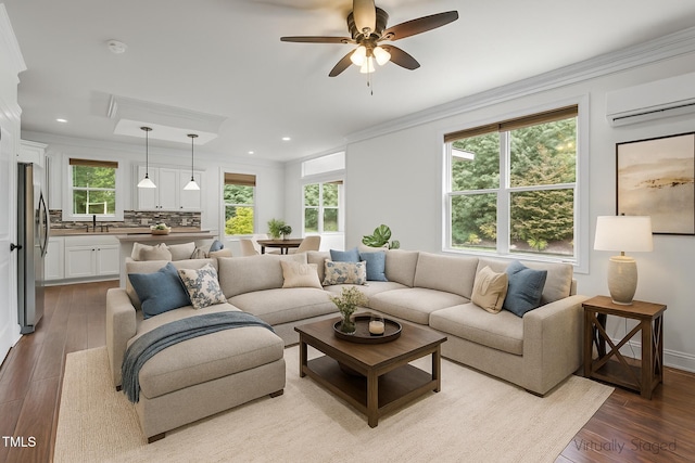 109 Rustler Rd, Louisburg, NC 27549 - living area with a wall unit AC, wood finished floors, ornamental molding, recessed lighting, and a ceiling fan