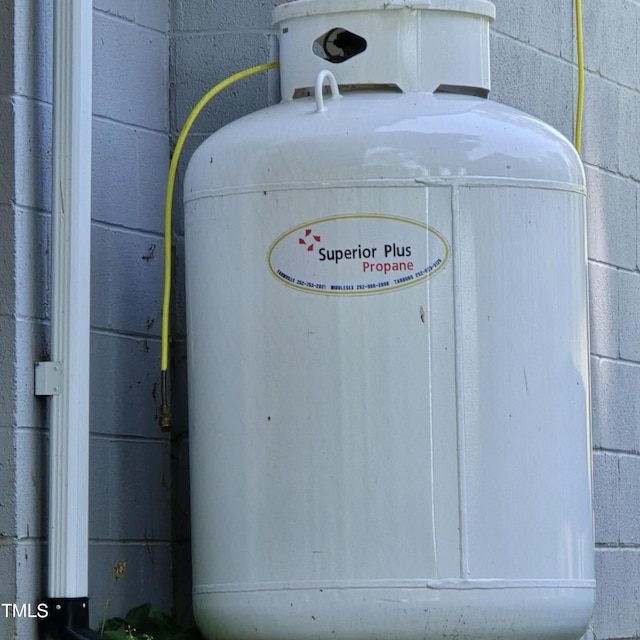 exterior details featuring concrete block siding and heating fuel