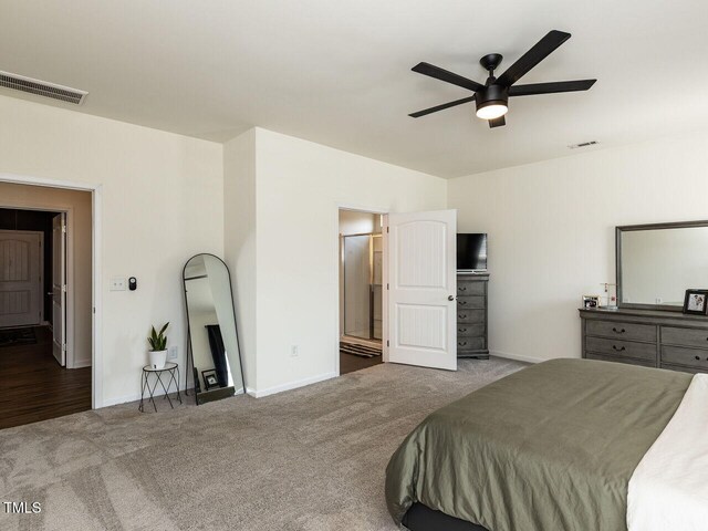 bedroom featuring visible vents, baseboards, carpet floors, and ceiling fan