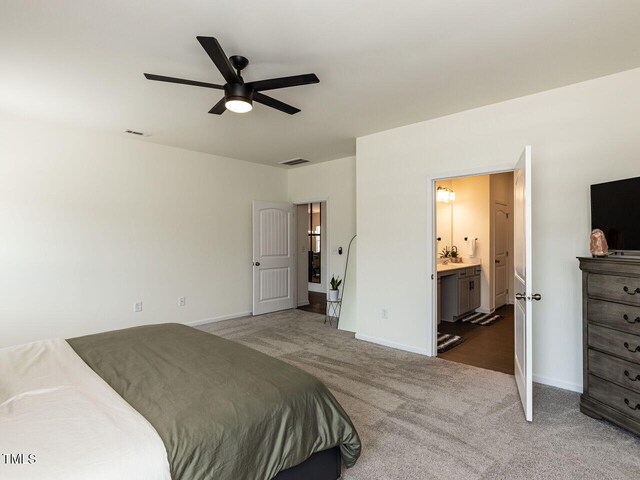 bedroom with visible vents, carpet, and baseboards