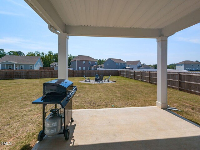 view of patio with a fenced backyard and a residential view