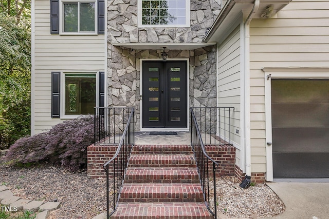 doorway to property with stone siding